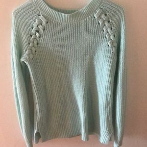 A light blue sweater, soft.